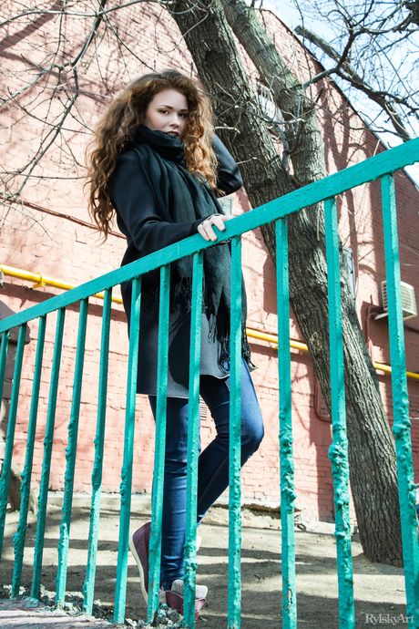 Delightful teen Estelle gets naked on a bench in a public park