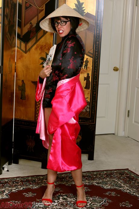 Asian MILF Gypsy Vixen strips and rubs her pussy after a striptease