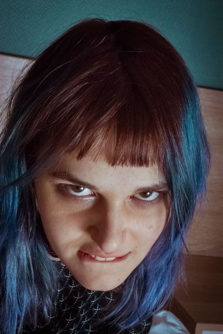 Young blonde Wivian fingers her pussy while bound in rope during solo action