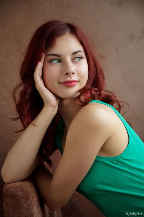 Redheaded teen Pearl Ami strips her black dress & poses nude in a solo