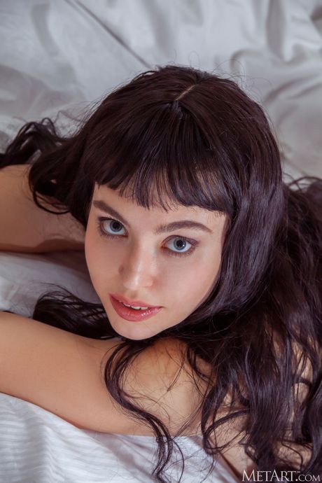 Magnetic teen Chantal removes her panties and bra to pose nude in a bathroom