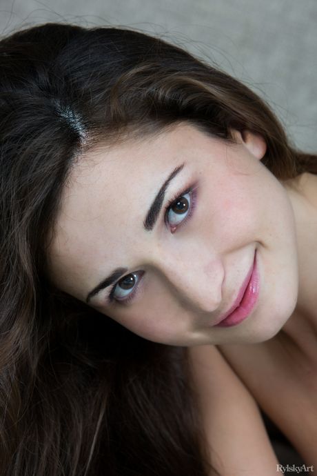 She poses in the nude, showing off her perky tits and tight ass