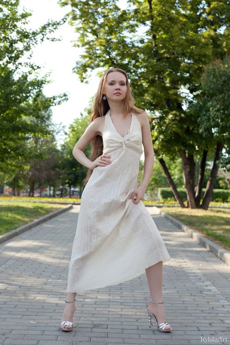 Slender teen Virginia Sun exposes her tiny tits and tasty muff on the floor