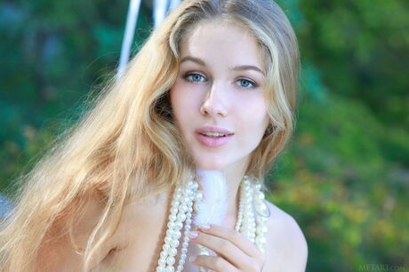 Russian babe Genevieve Gandi flaunting big teen tits & bald cunt outdoors