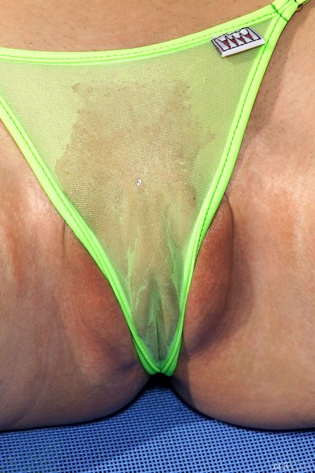 Delicate teen Janet removes her bikini and sunglasses to pose nude by the pool