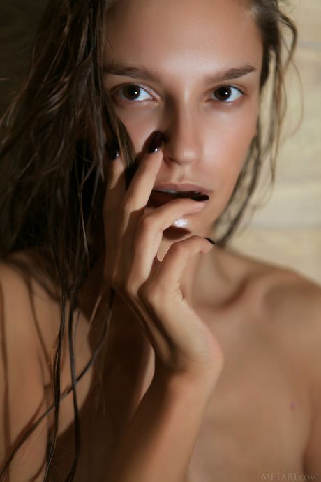 Stunning teen Elin removes her bath towel and poses naked in the bathroom