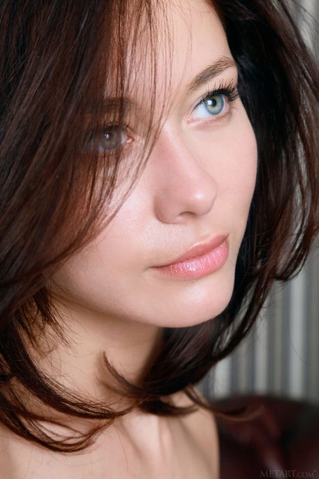 Ukrainian babe Mila M displays her big tits and poses in stockings