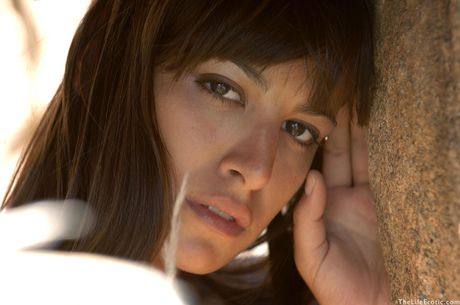 Perfect teen Lola poses nude on a rocky outcrop confidently