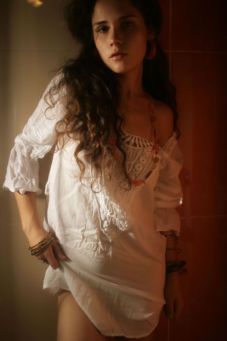 Winsome teen Ira I gets naked in a bathtub while taking a shower