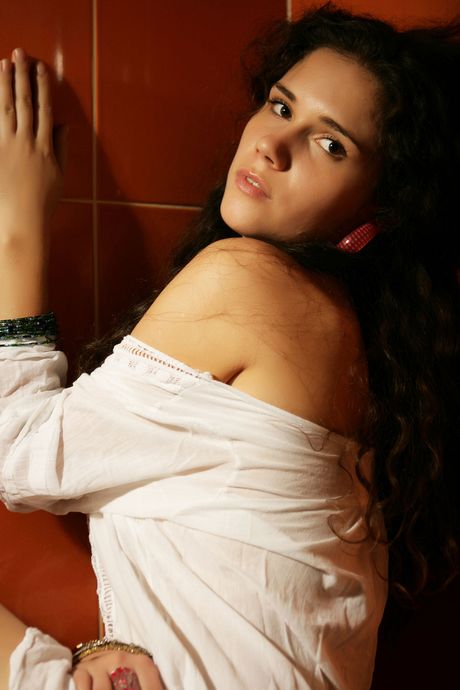 Winsome teen Ira I gets naked in a bathtub while taking a shower