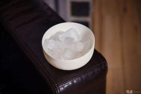 Cute teen Zuzu Sweet removes a leather jacket to pose nude in a bowl of ice