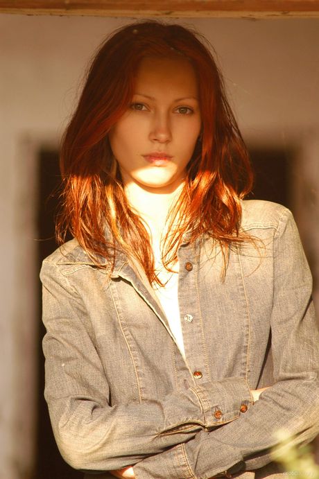 Sexy redhead Carla gets naked on a blanket in the backyard