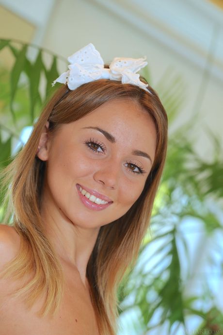 Slender teen Linda Chase removes her lingerie and poses nude in a bathroom