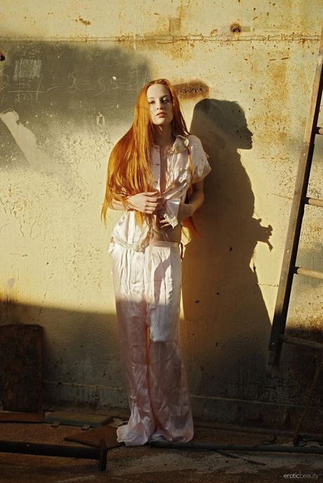 Skinny redhead Sally A gets naked in the wild and poses her sexy body