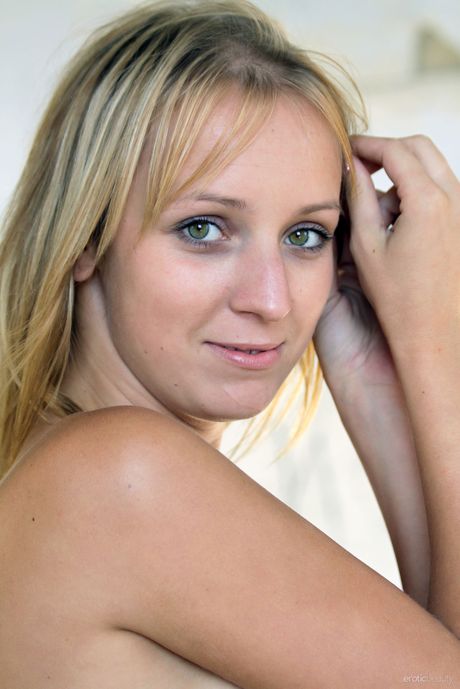 Blonde teen Ilona D gets naked in a ruined building while on vacation