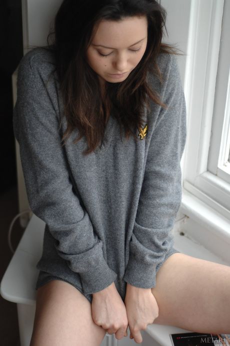 Delicate teen Brionie W goes nude on a sofa confidently