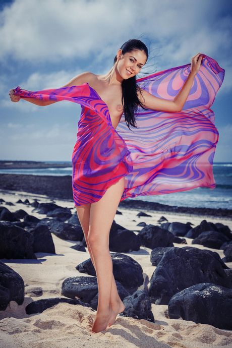 Ukrainian beautiful Macy B models totally naked on a rocky beach