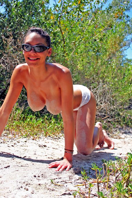 Sexy blonde Dee Dee shows her big tits & bares it all in a solo