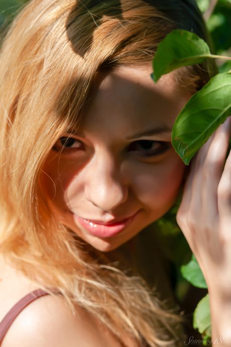 18-year-old blonde Kimberly goes naked on a blanket in a forest