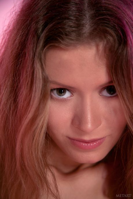 Alluring teen Oliwia A removes her stockings to get totally naked