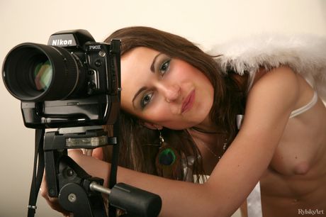 Beautiful teen Beata poses nude in a sensual manner on a bed