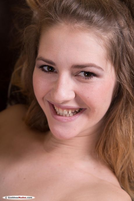 Endearing teen Amanda D removes her stockings to get totally naked
