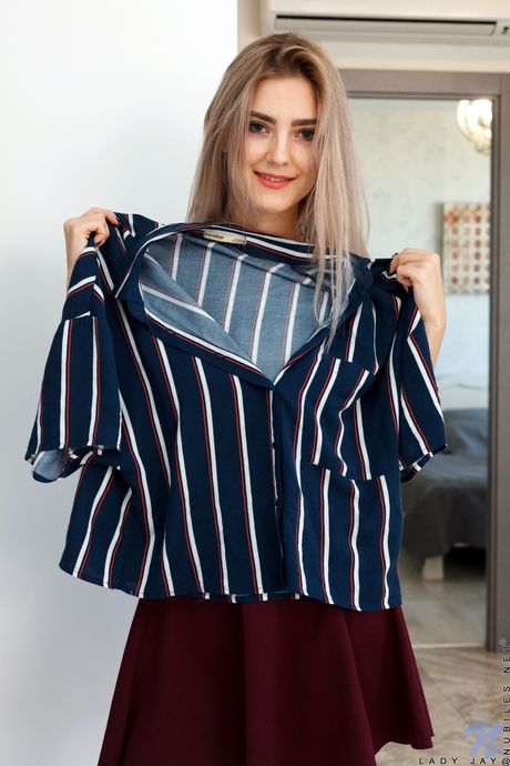 Ligh-haired teen Lady Jay removes a dress before masturbating in white socks