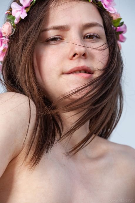 Young brunette Matty gets naked on a rocky beach