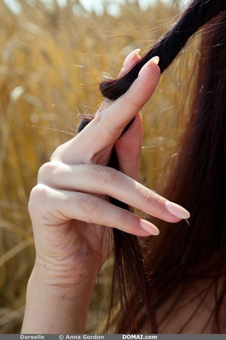 Delicate teen Darselle shows her small tits and goes naked in a solo