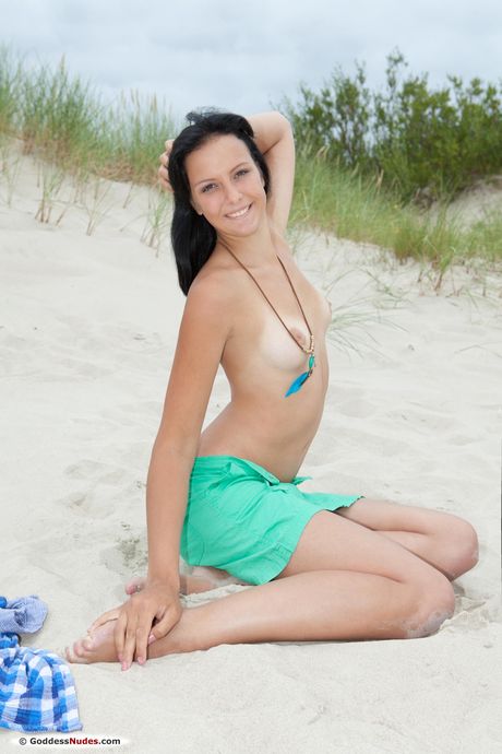 Lovely teen Masha L strips and teases with her hot ass and pussy at the beach