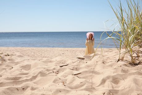 Delicate teen Patritcy A fingers her pussy while naked on a beach