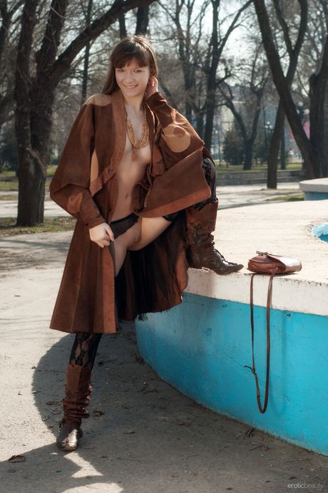 Natural redhead Red Eva strips down in a public place