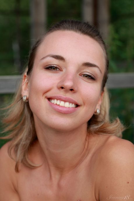 Blonde teen Nicole V takes it all off on a concrete slab in heels