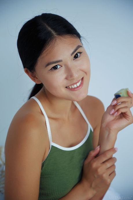 Petite teen Kimiko strips & displays her tiny tits & shaved pussy in a solo