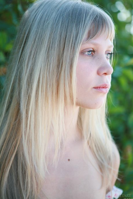 Skinny blonde Leya A strips naked & poses on the rocky beach