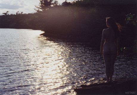 Sexy Canadian teen Ronin poses naked on a rocky beach during a solo shoot