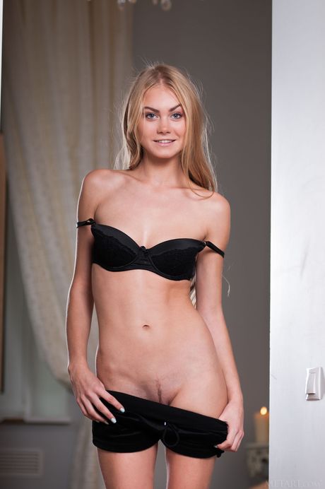 Svelte teen Nancy A strips off her lingerie and poses nude in a solo