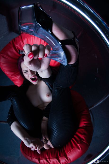 Gorgeous teen Candi removes a black jumpsuit before toying her pussy