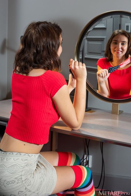 Ukrainian model Oxana Chic removes her clothes and socks to pose nude