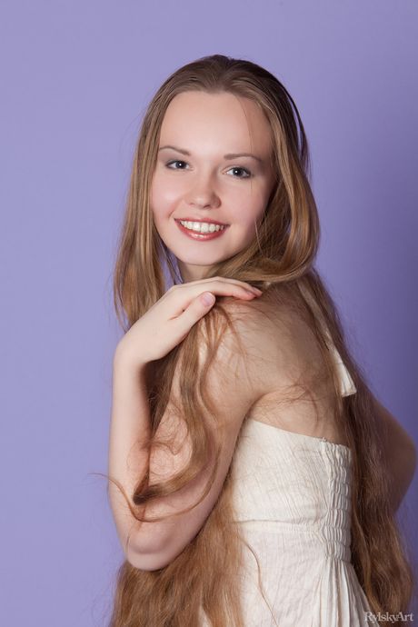 Young blonde Virginia Sun gets naked on a patio chair