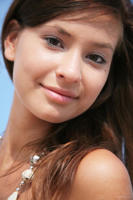 Thin teen Irina J strips naked and poses nude in the backyard