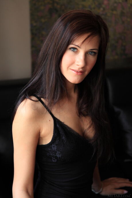 Lauren Crist removes her black bra and panty set and poses