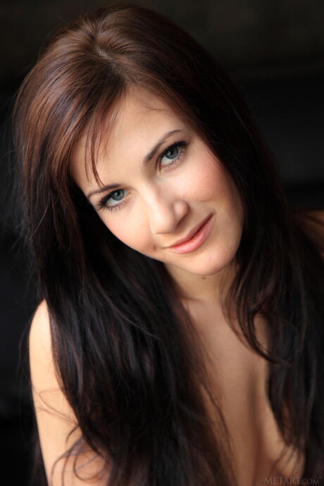 Lauren Crist removes her black bra and panty set and poses