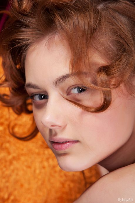 Rylsky Art: Slender teen with a beautiful face Amy poses naked in a dark room