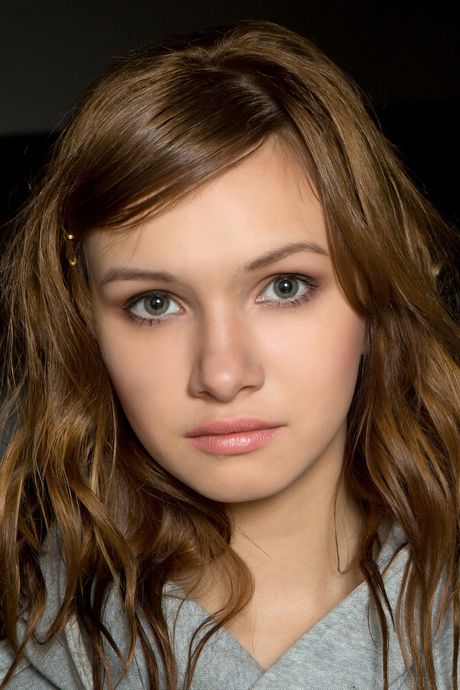 Beautiful teen Demetra A removes her stockings and poses naked