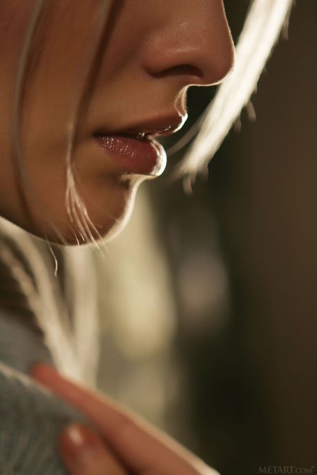 Sexy blonde teen Kira W gets naked in a pair of socks and a dress