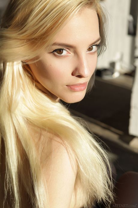 Blonde teen Kira W gets naked with grace on her bed