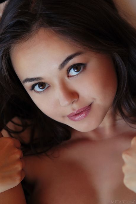 Pretty teen Li Moon shows her big tits and pussy sensually