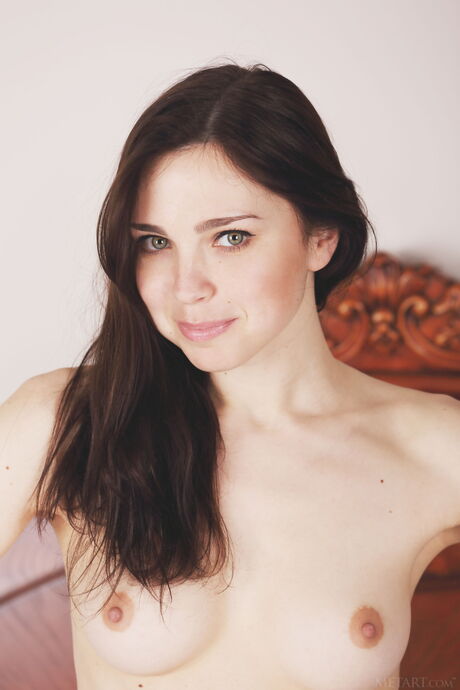 Ukrainian cutie Anita E removes her panties to pose nude