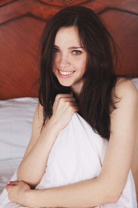 Ukrainian cutie Anita E removes her panties to pose nude